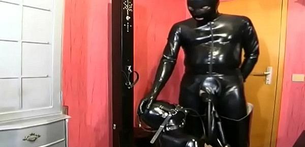  Black latex and rubber cock